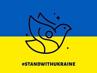 Fairtrade-Mitgliedsorganisationen rufen zu Spenden für die Menschen im Ukraine-Krieg auf. Zu sehen ist das Icon einer Friedenstaube vor blau-gelbem Hintergrund